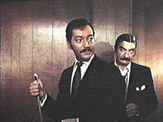 Leo and his literally greasy henchguy, Marty