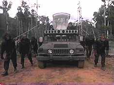 Moreau makes his entrance atop this ersatz Popemobile.