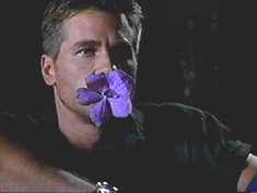 Method actor Val Kilmer sucks on a flower. Its an artistic choice. Really. Trust me.