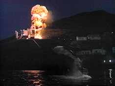 ...resulting in the nearby oil refinery (?!) ‘dramatically’ exploding.