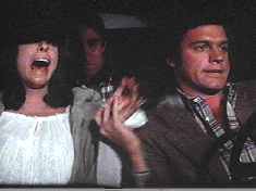 Actor Collins projects abject terror (as does ‘Ben’ in the backseat) as his character faces an imminent, horrible death in a car crash.